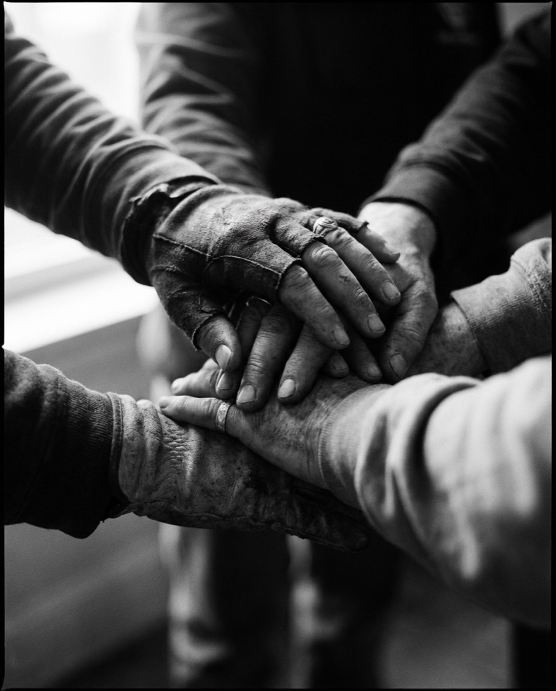 Volunteers' hands together